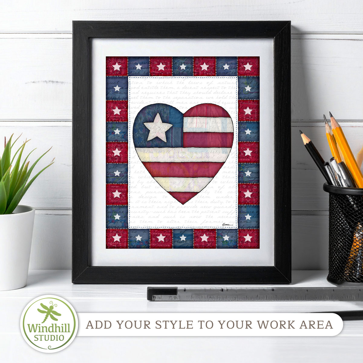 Patriotic Wall Art Printable - Americana Heart with quilted stars and red white blue fabric texture in a frame on a desk.