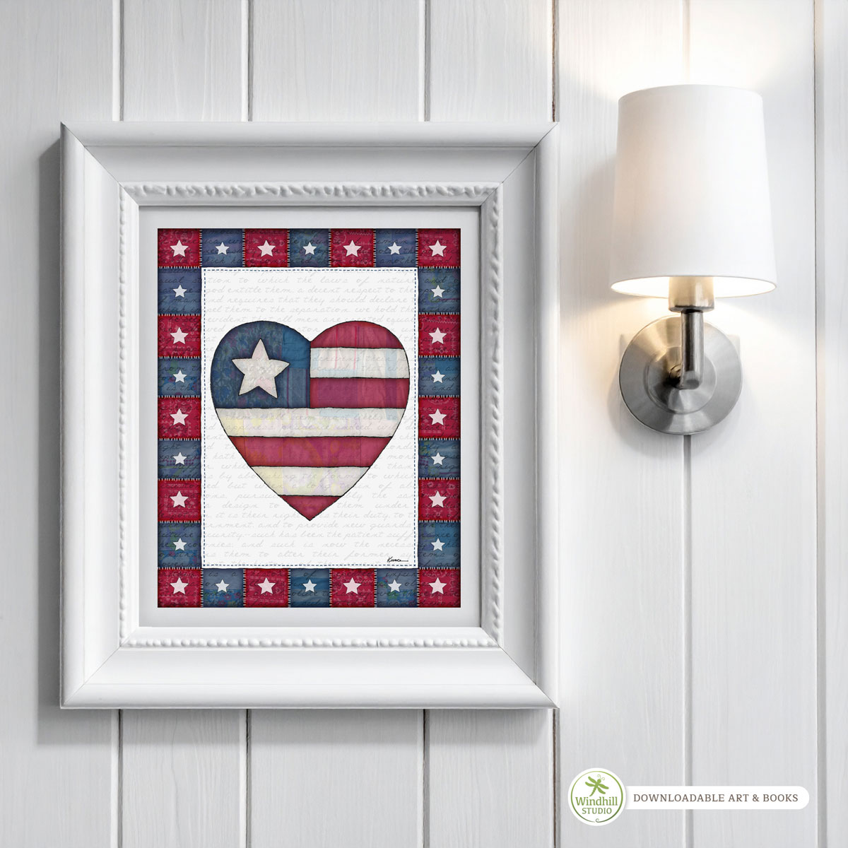 Patriotic Wall Art Printable - Americana Heart with quilted stars and red white blue fabric texture hanging in a frame on a wall.