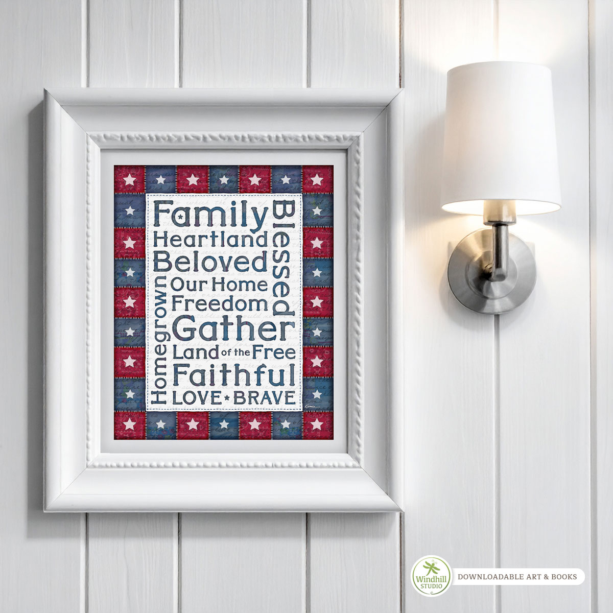 Patriotic Wall Art Printable - Americana Word Art with quilted stars and red white blue fabric texture hanging in a frame on a wall.
