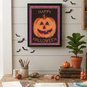 Halloween pumpkin artwork framed on an office wall