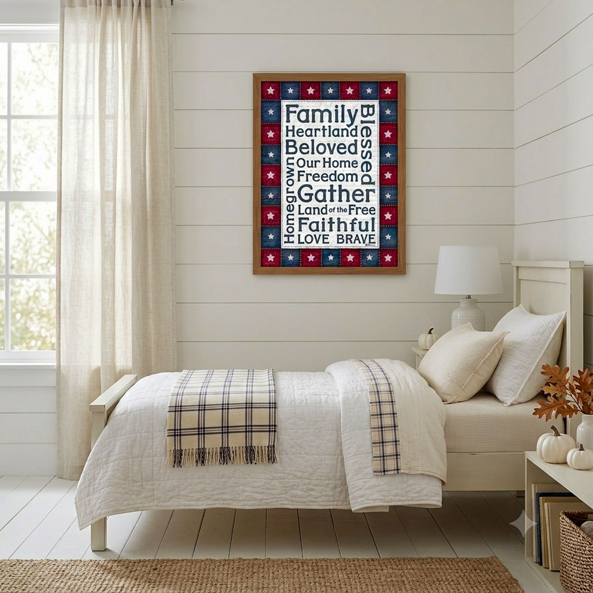 Photo showing a framed print of an American stars patchwork quilt border with patriotic words designed in the middle.