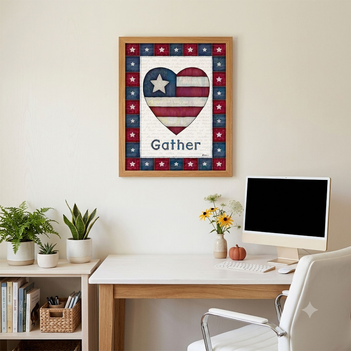 Photo showing a framed print of an American flag graphic inside of a heart with the word Gather below it.