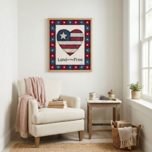 Photo showing a framed print of an American flag graphic inside of a heart with the word Land of the Free below it.