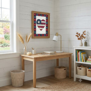 Photo showing a framed print of an American flag graphic inside of a heart.