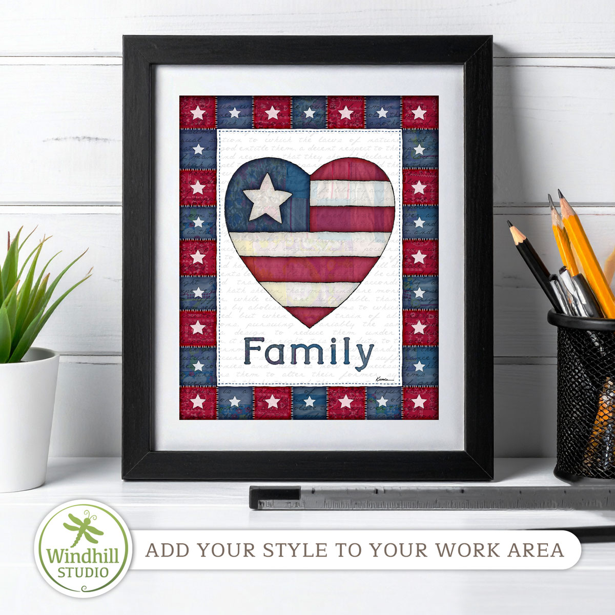 Patriotic Wall Art Printable - Family Americana Heart with quilted stars and red white blue fabric texture in a frame on a desk.