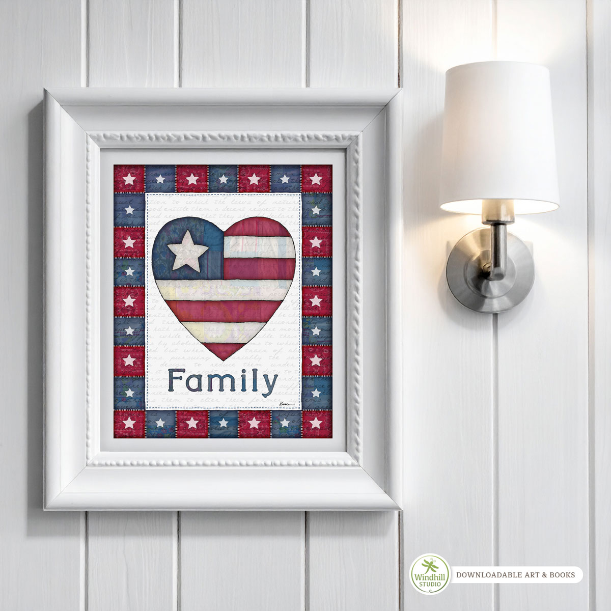 Patriotic Wall Art Printable - Family Americana Heart with quilted stars and red white blue fabric texture hanging in a frame on a wall.