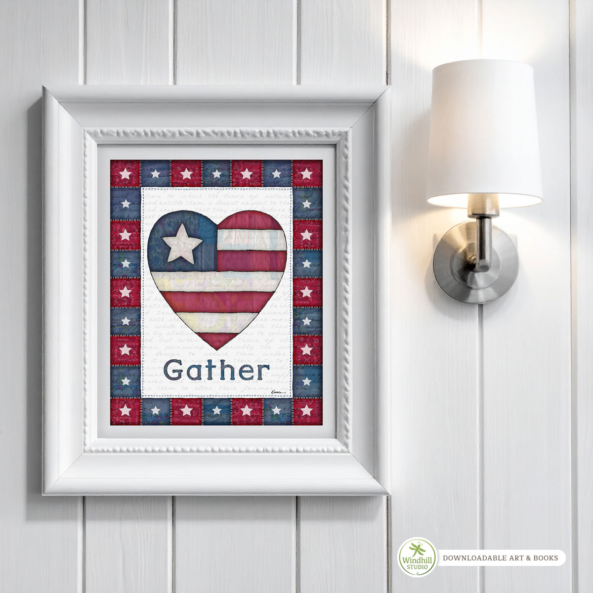 Patriotic Wall Art Printable - Gather Americana Heart with quilted stars and red white blue fabric texture hanging in a frame on a wall.